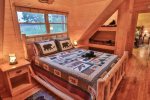 Queen bed in loft with bear bunks.